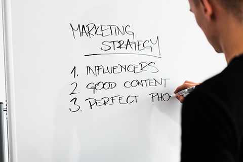 marketing-expert-writing-new-marketing-strategy-on-whiteboard-picjumbo-com